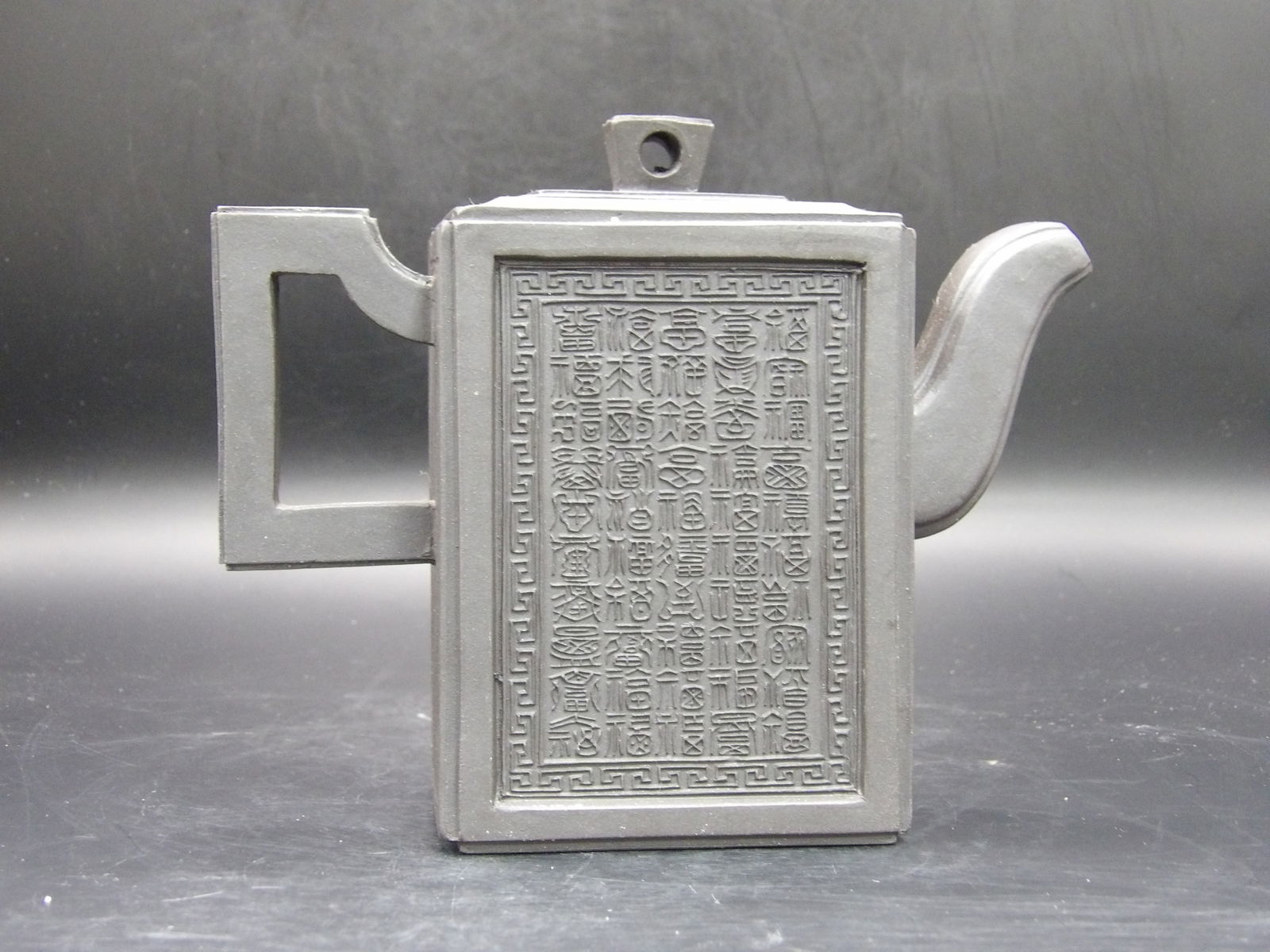 Yixing Teapot Chinese Calligraphy: Both front and back are full of Chinese calligraphy. Size is 5.5 x 2.3 x 5 inches.