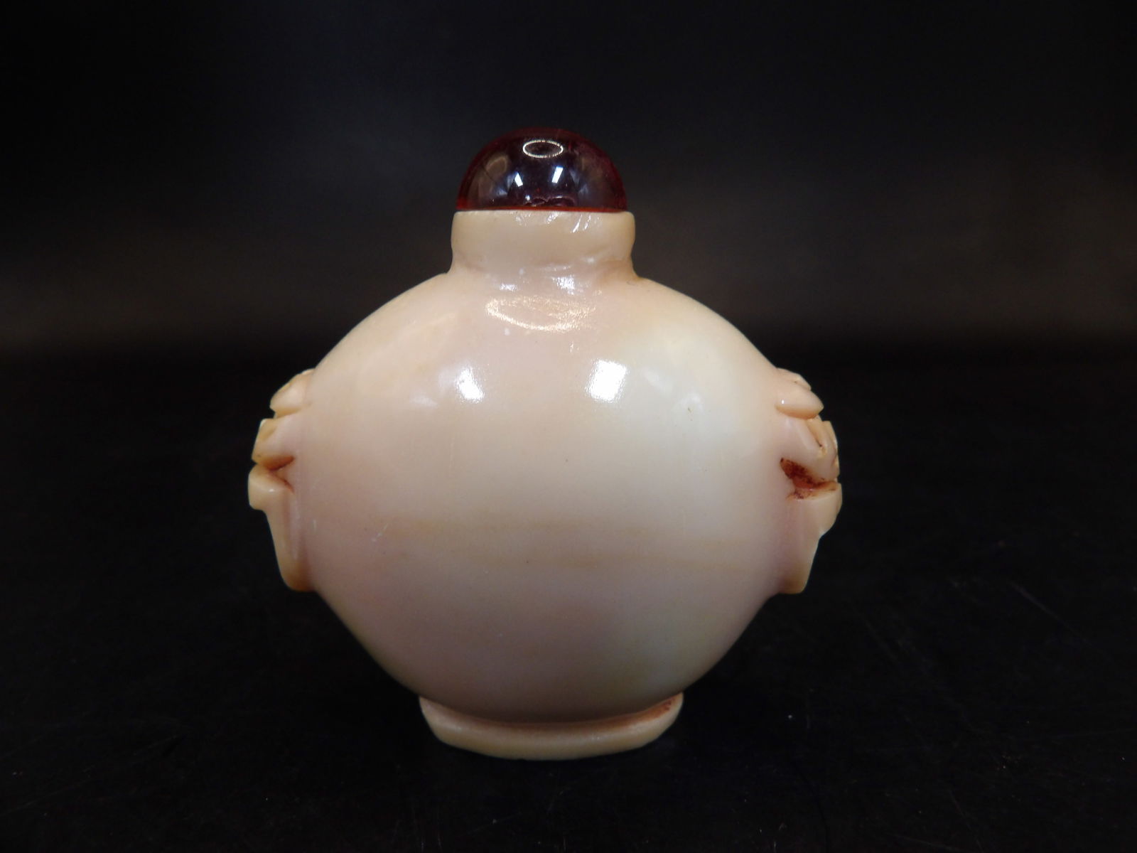 Chinese carved coral? stone snuff bottle with mask handles (1 of 7)