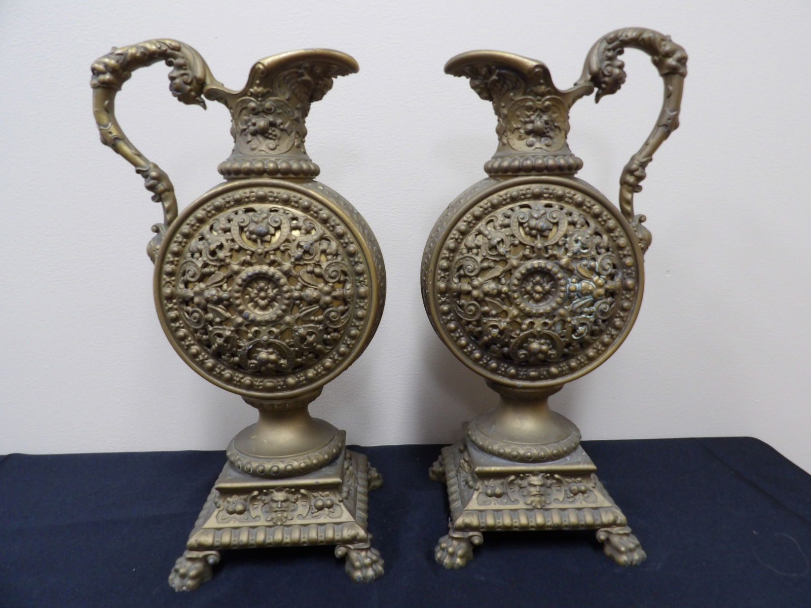 Very ornate pair of brass mantel urns: 13 inches height.