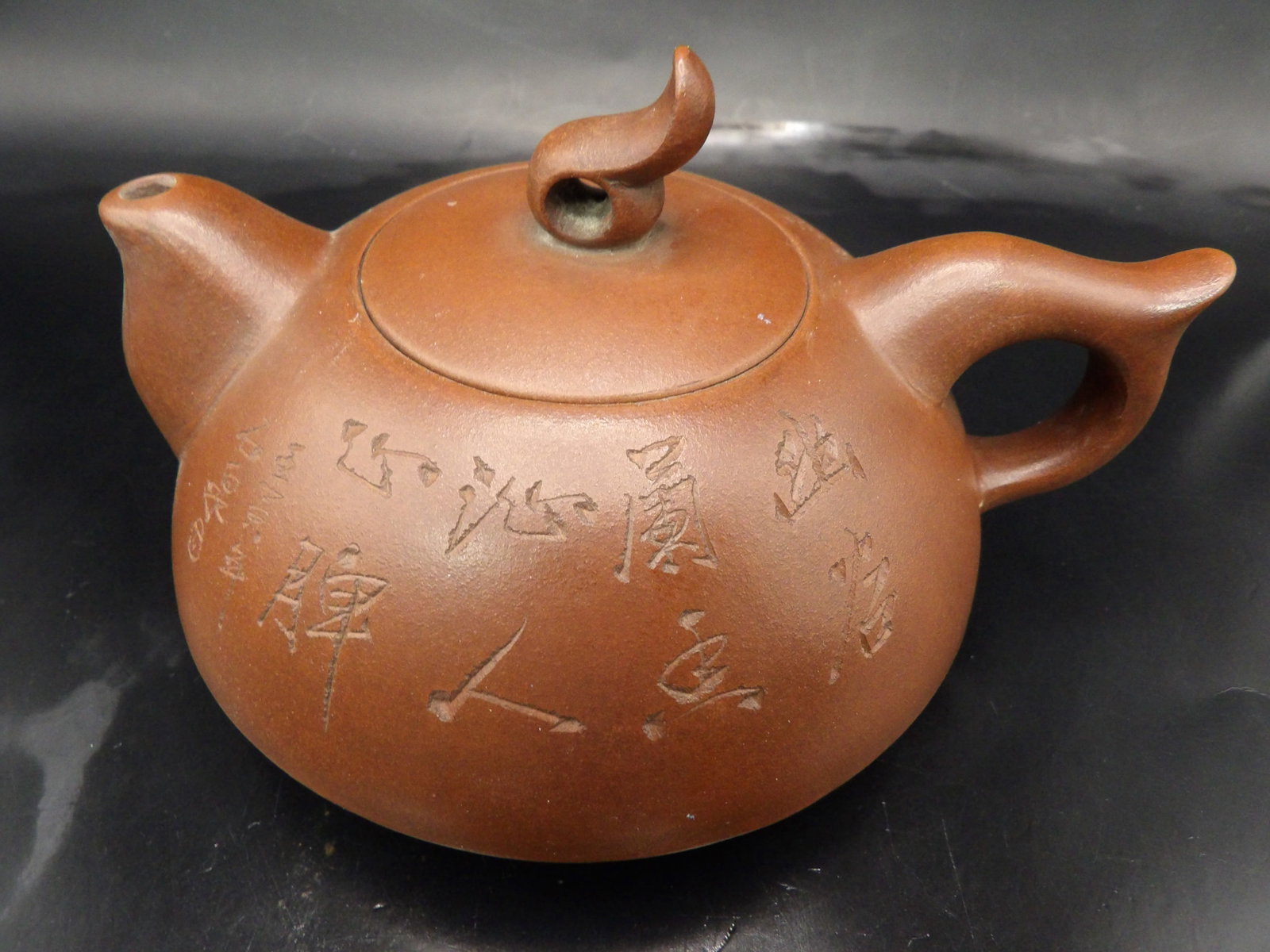 Chinese yixing teapot with carving and calligraphy signed: 5.6 inches length.