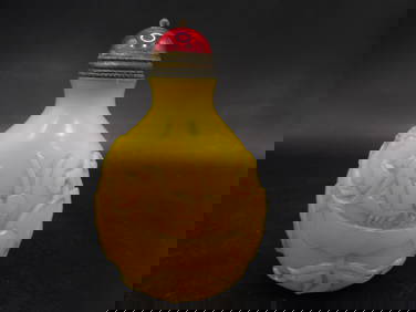 Chinese yellow glass snuff bottle with raised motif and Qing dynasty Qianlong mark (1 of 6)
