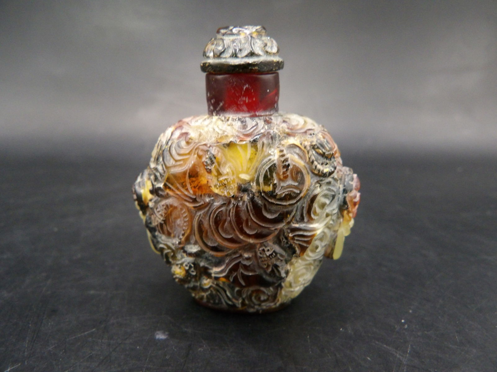 Antique Chinese carved amber snuff bottle with lion heads (1 of 7)