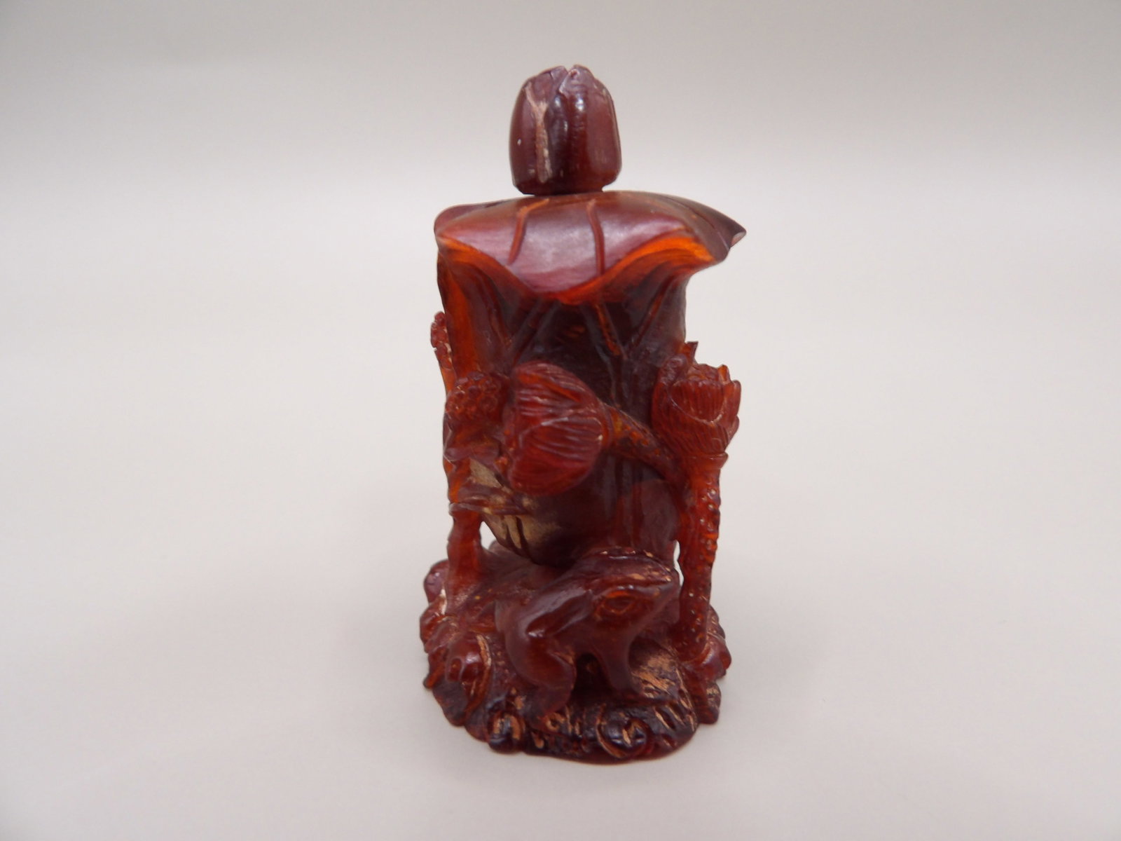 Chinese lotus frog snuff bottle amber?: 1.8 inches height.
