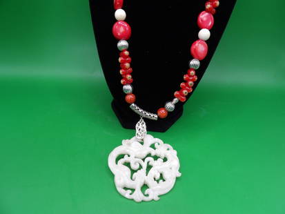 Chinese large carved double dragon jade pendant with coral bead necklace: Pendant is 2.4 inches height. Necklace is 20 inches long.