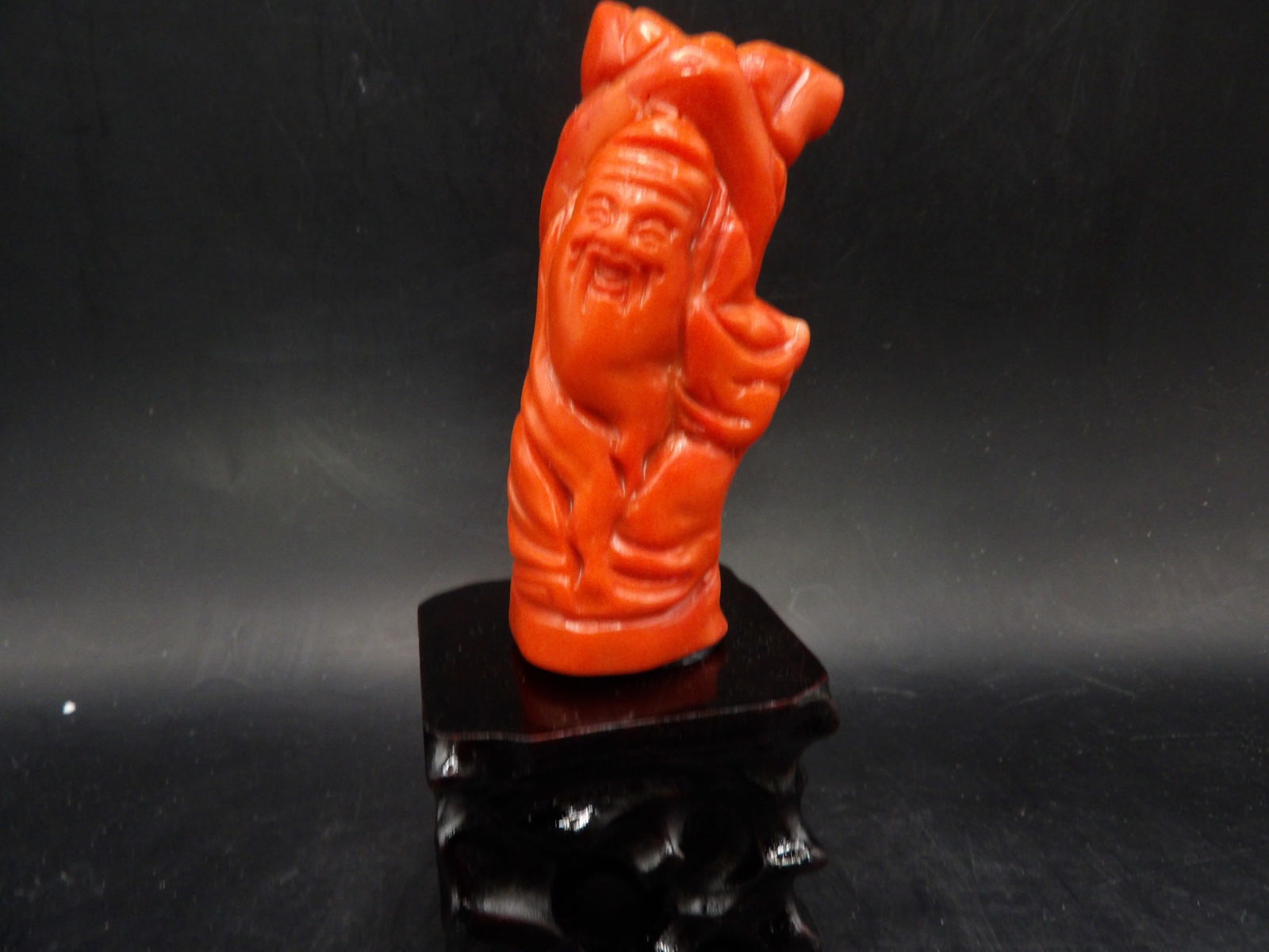 Chinese coral carved Longevity God statue adhered to wooden base: 5 inches height.