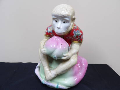 Chinese monkey holding a peach porcelain statue: 12 inches height.