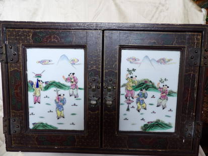 rare 19th century Chinese antique wooden cabinet with 2 hand painted porcelain  plaques: Cabinet size is 23 x 12 x 15.5 inches. Each hand painted children playing scene porcelain plaque size is 6.6 x 9.6 inches. Hand painted beauty and flowers on the top and sides.