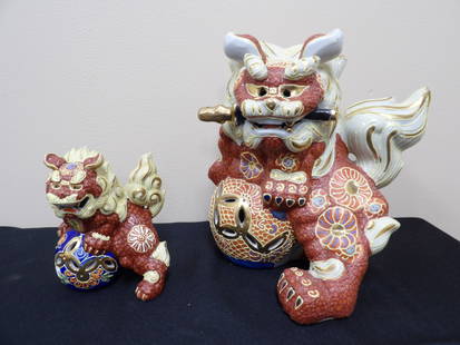 Lot of 2 ornate Asian porcelain guardian lion statues: Taller one is 8.5 inches height with protective film on the bottom.