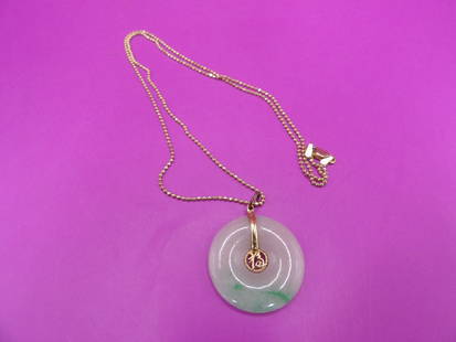 Chinese jadeite jade pendant with 14k gold marked necklace: 18 inches length 14k marked gold necklace. Pendant with bail is over 1 inch height. Total weight 6.7 grams.