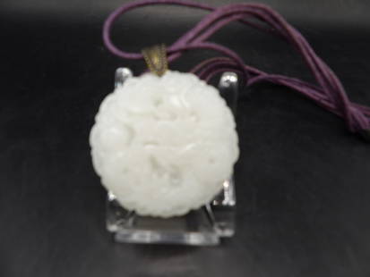 Chinese jade carved dragon pendant: 1.8 inches diameter.