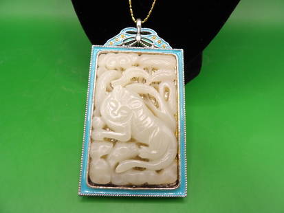 Large carved jade with enamel backing pendant: Pendant is 3 inches height. 18 inches long gold tone necklace.
