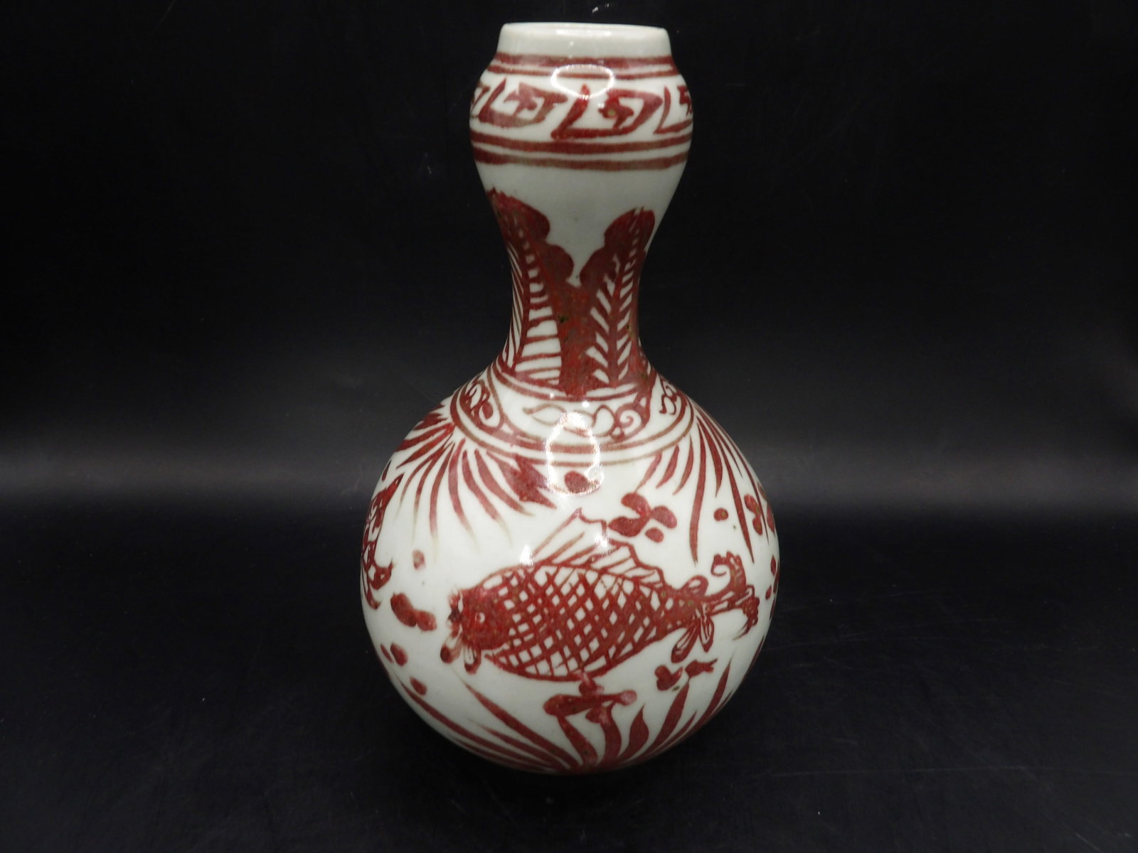 Chinese red underglaze fish pond scene porcelain garlic vase: 7 inches height.