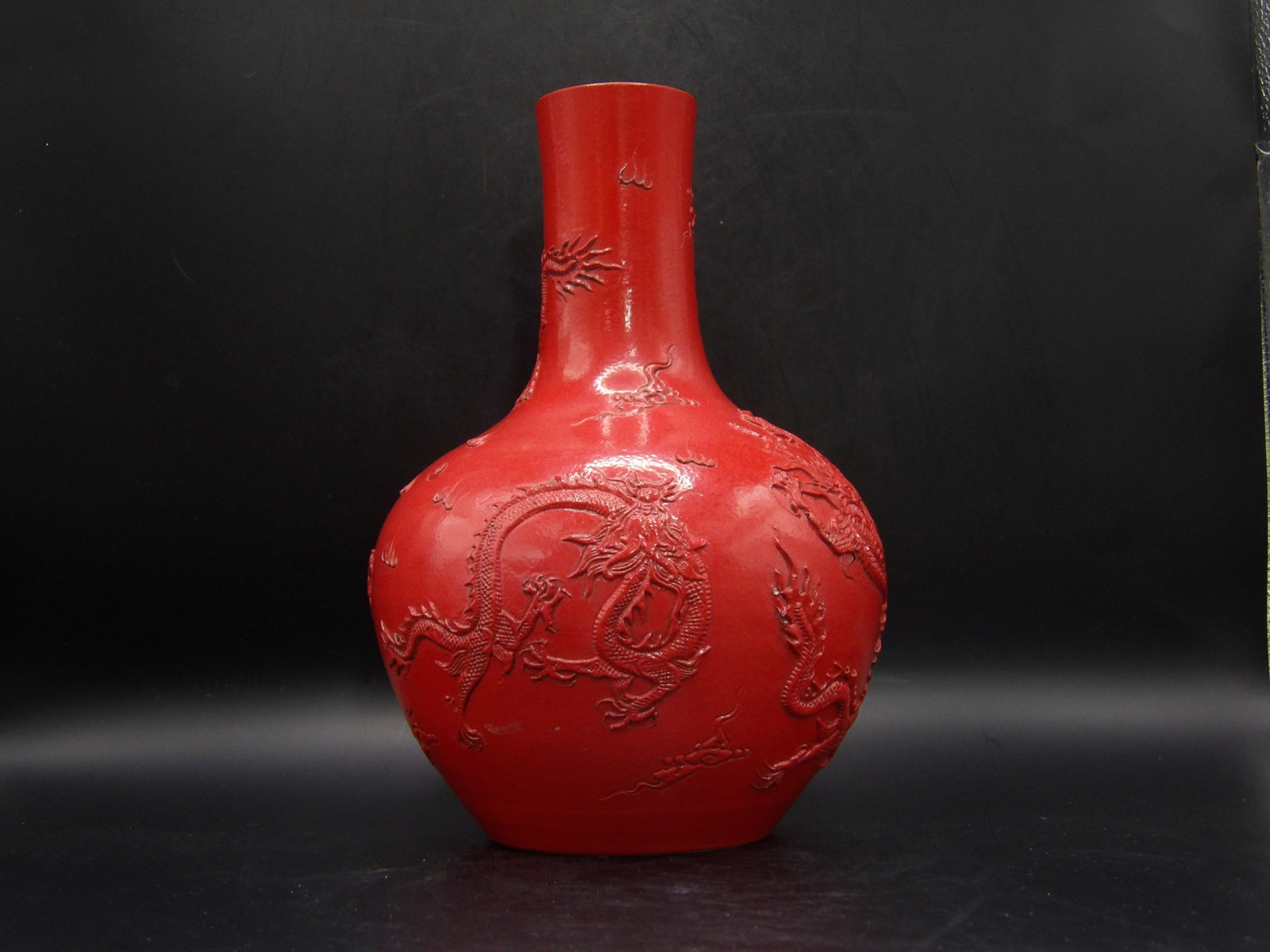 Chinese Red Porcelain Dragon Vase with Qing Dynasty Qianlong Marking: 9.2 x 6 x 6 inches.