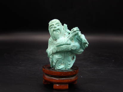 Chinese Qing Dynasty Turquoise Standing Man Carving: A bat on the side. Fine Chinese antique turquoise carving. 3 inches height with custom wooden stand.
