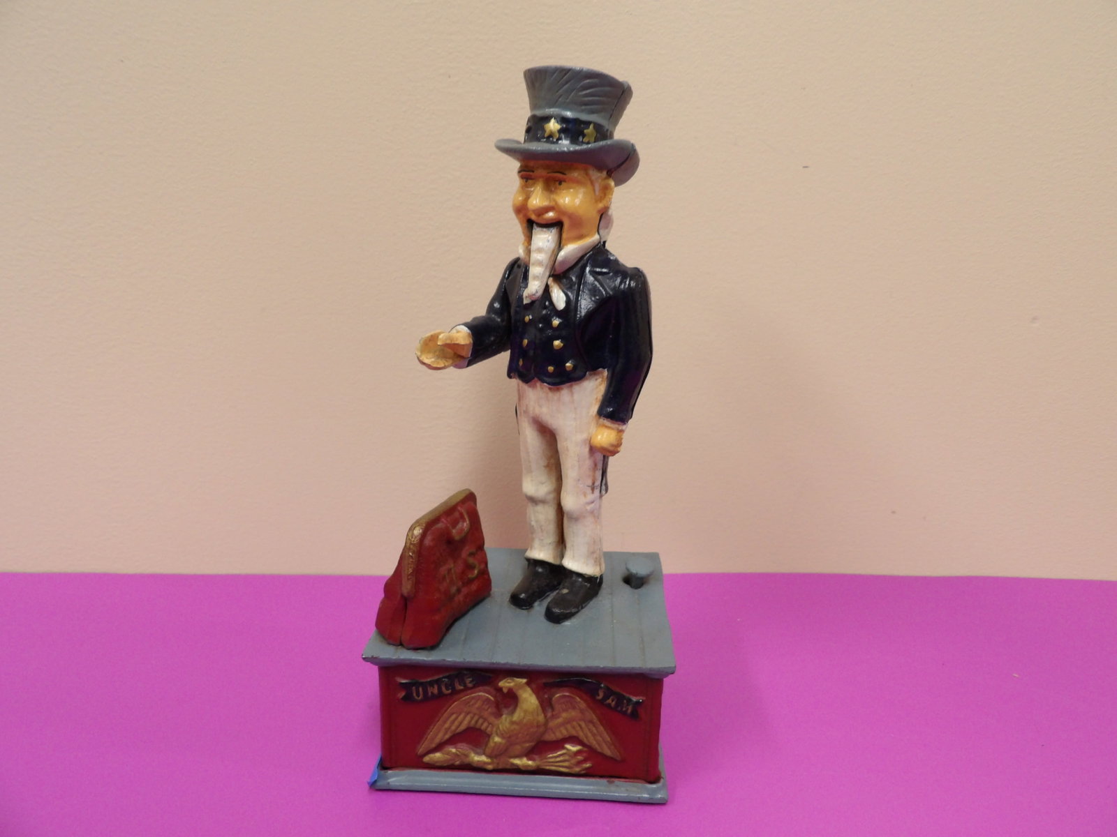 Uncle Sam cast iron mechanical coin bank: Approx. 11 inches height. Bottom white plug is loose.