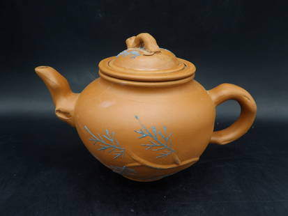Chinese Yixing teapot with strainer signed on the bottom: 6.5 inches length.