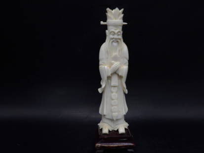 Very fine carved natural material antique Chinese scholar figurine - No Export: Chinese calligraphy on figurine's robe. Figurine is adhered to wooden base and total height is 7 inches. No Export.