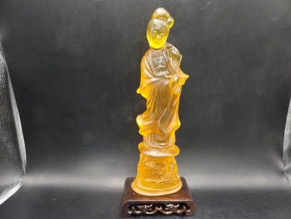 Chinese amber Kwan Yin figurine with wooden base: 10.3 inches height.
