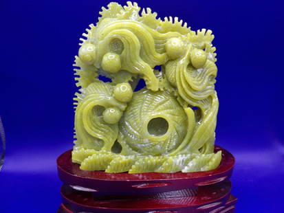 Chinese carved dragon jade statue with wooden base: 1224 jade weight. Statue is 6.6 inches height. With wooden base 10.3 inches height.