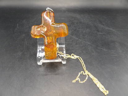 natural amber carved cross pendant and 18k gold 24 inches long necklace: 4.4 grams 24 inches long necklace is marked and tested as 18k. Cross pendant is 2.5 inches height not including bail.
