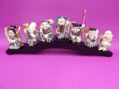 Seven Lucky Gods Japanese deities figurines on wooden base: Figurines are over 2 inches height. Wooden base is 11 inches length.