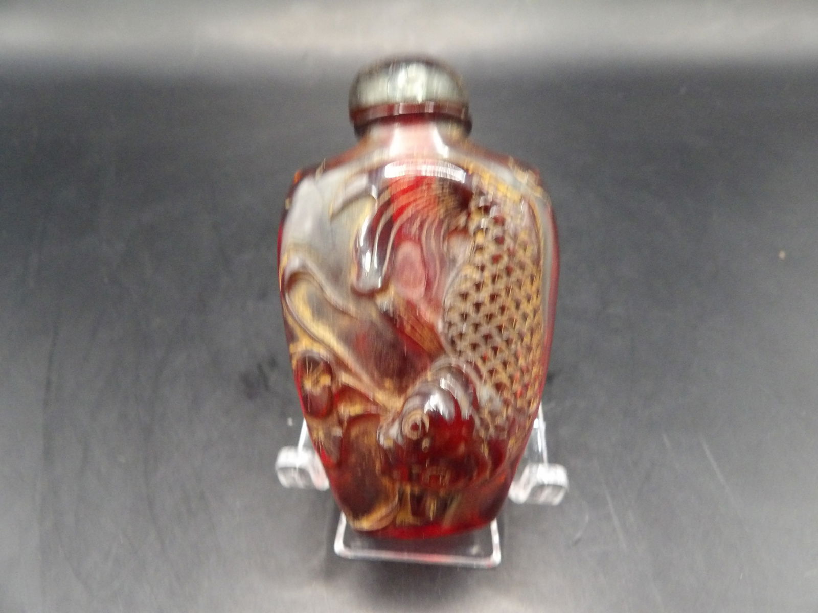 Chinese fish motif amber? snuff bottle with Chinese characters: 2.7 inches height.