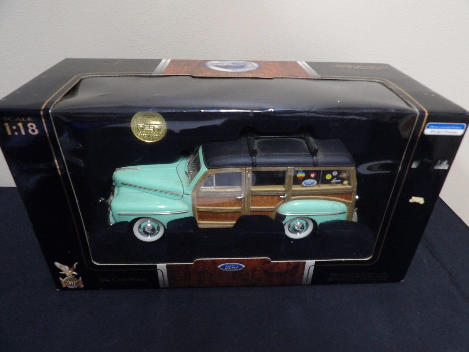 Ford signature series 1948 Woody diecast metal with gold plated coin: 10.5 inches length scale car in 14.8 inches length box.