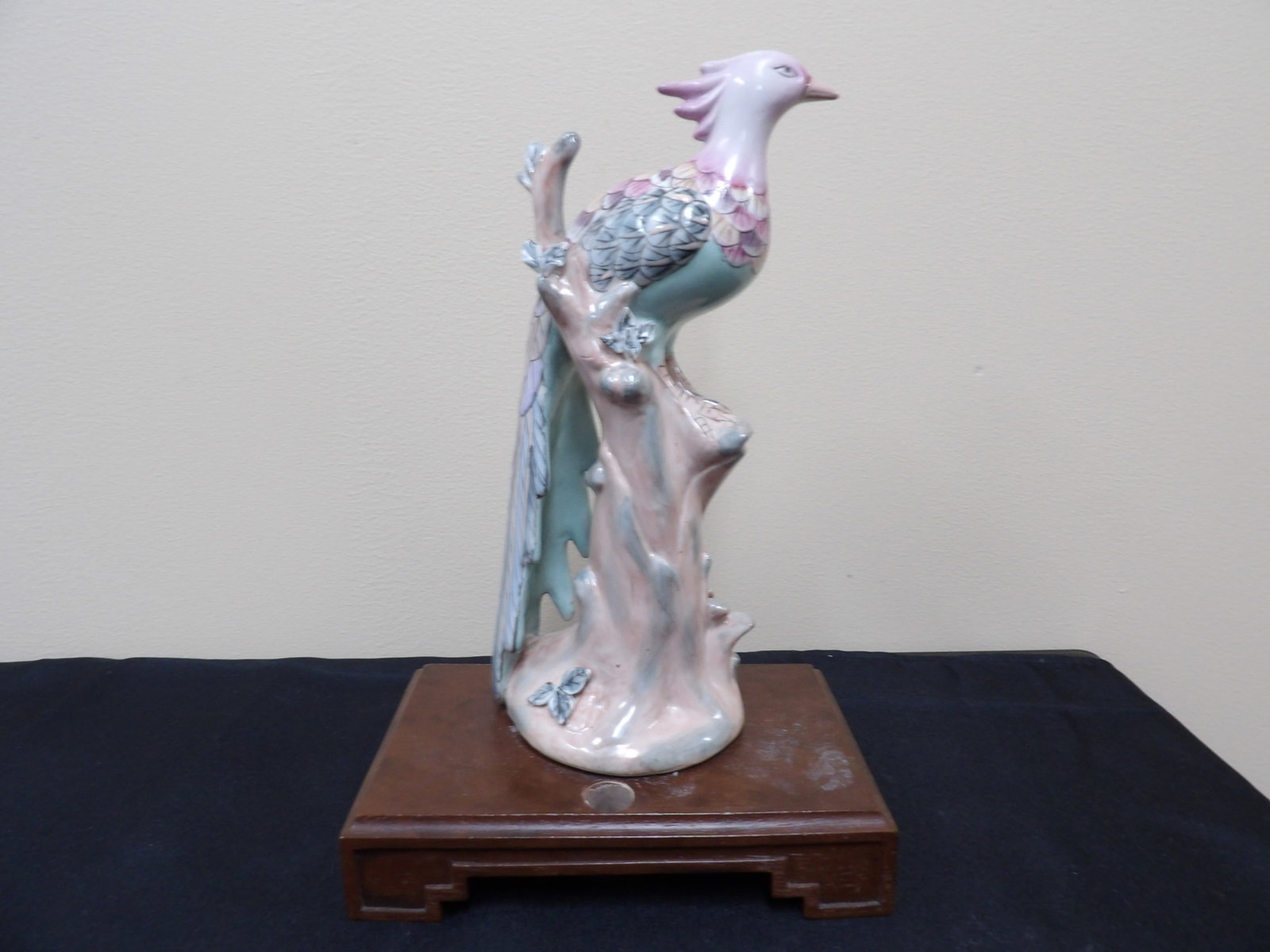 Chinese porcelain phoenix figurine on wooden base: Figurine is 10.3 inches not including wooden base. Figurine will be detached from base for shipping.