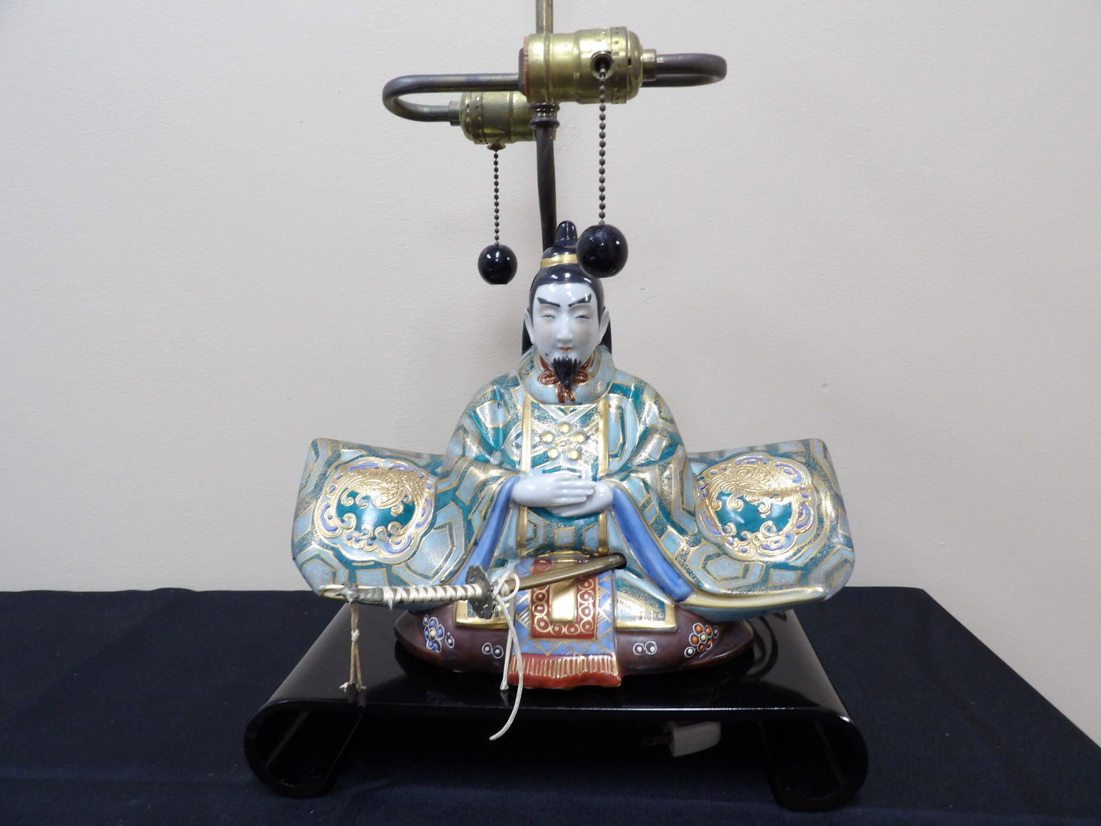very fine Japanese porcelain warrior sitting on a lamp: 21.6 inches height. Gold gilt porcelain figurine is not attached to the lamp.