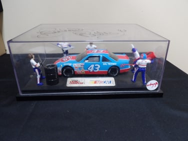 rare autographed by Nascar Racing Champion Richard Petty #43 Plymouth with crew