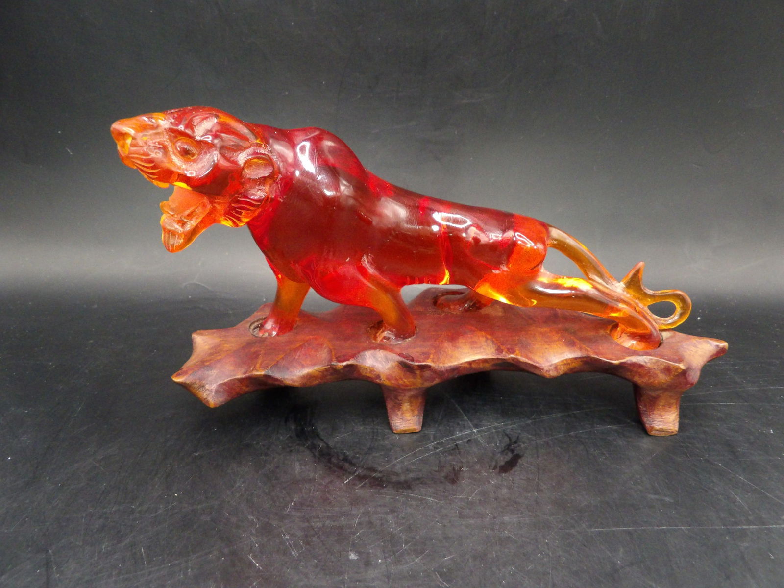 Chinese fine amber tiger carving with wooden stand: Amber tiger is 5.8 inches length.