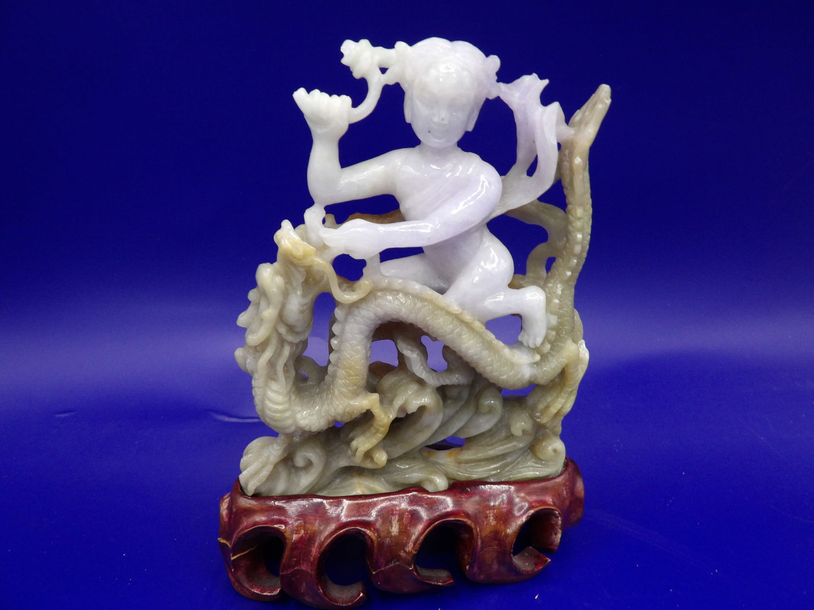 Antique Chinese jadeite jade carving of a girl on top of dragon with custom wooden base: 221 jadeite jade weight. Statue is 4.5 inches height. With wooden base 5.3 inches height. Chips/loss