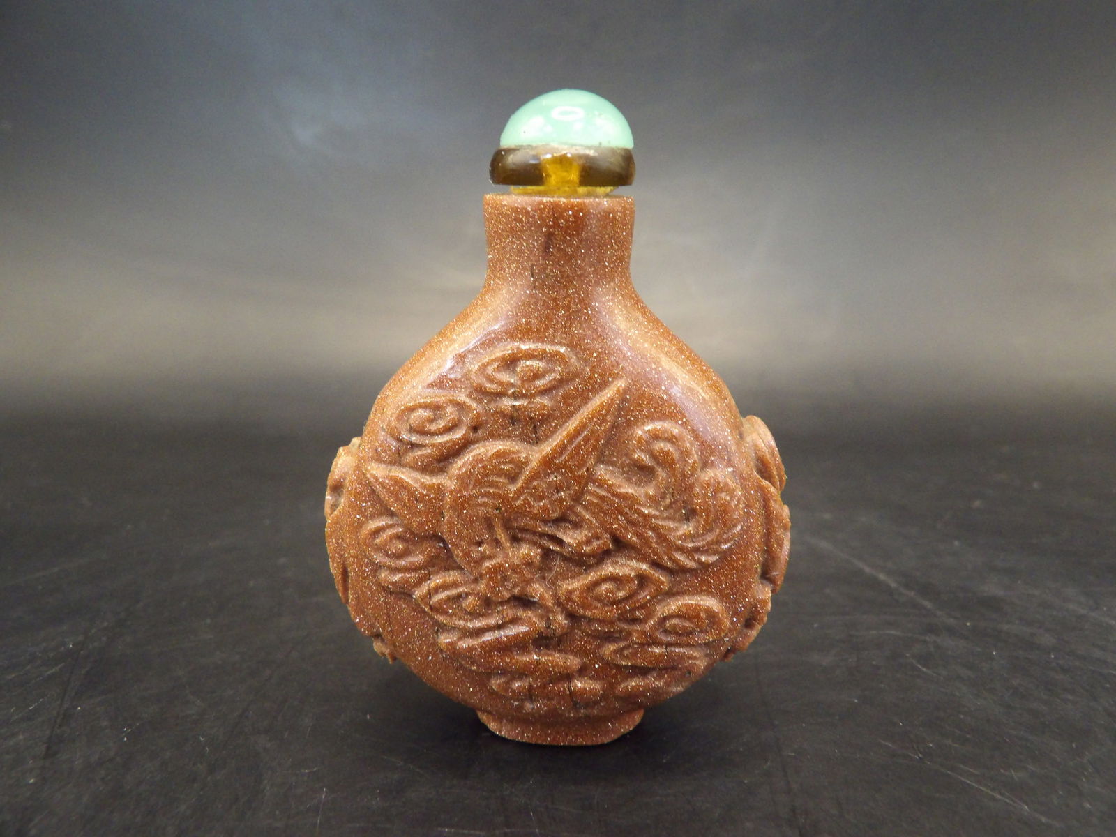 antique Chinese Qing dynasty goldstone carved phoenix snuff bottle (1 of 5)