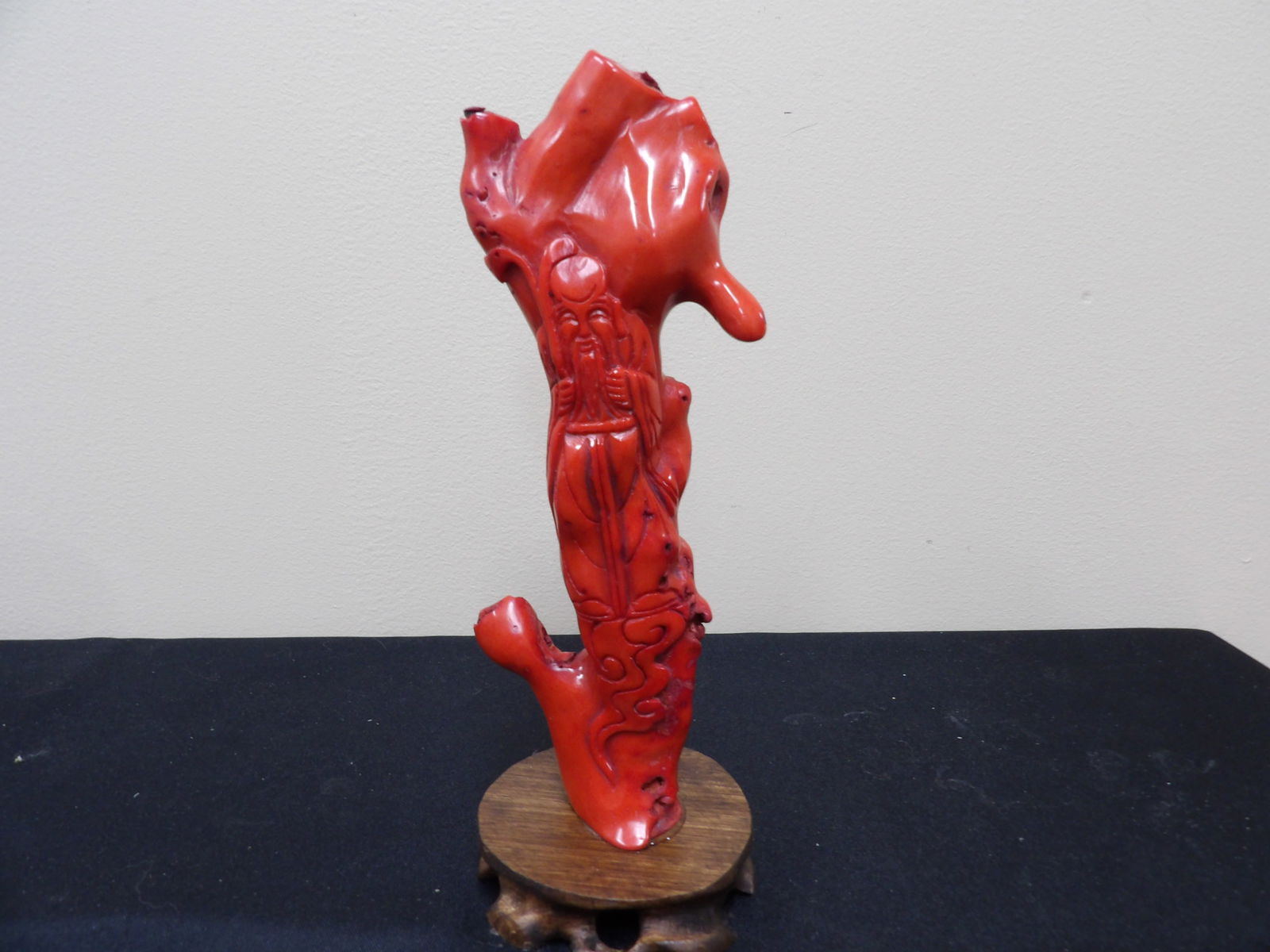 Chinese coral carved Longevity God adhered to wooden base: 9.2 inches height including wooden base.
