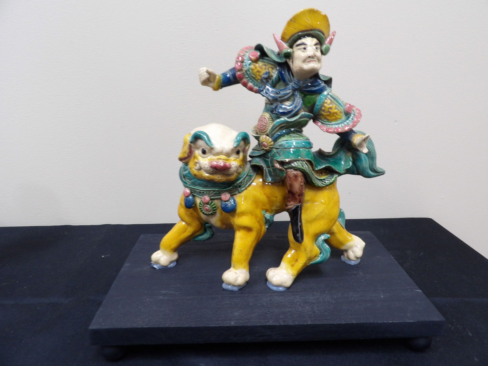 antique Chinese roof tile a warrior riding mythical creature on a base: Approx. 11.4 inches height including base.