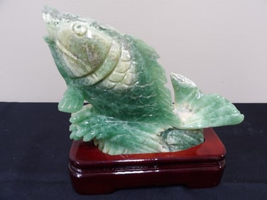 Chinese green agate or quartz carved fish sculpture on custom wood base