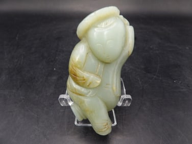 Chinese jade boy holding lotus carving