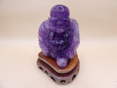 Asian very fine amethyst carved buddha figurine on wooden base