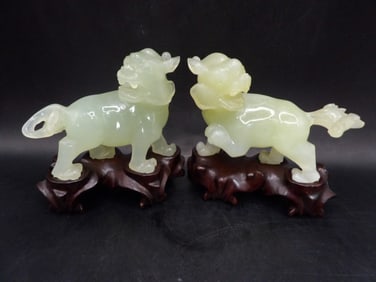 Pair of Chinese jade beast carving with wooden base