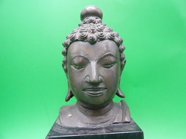 Antique fine southeast Asia bronze buddha head mounted on wood base
