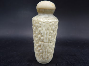 antique Chinese carved bone snuff bottle with many Buddha's faces