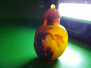Chinese carved well hollowed agate snuff bottle with raised boy and tree