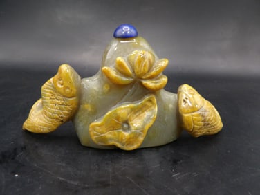 Chinese carved agate snuff bottle with raised fish and lotus motif