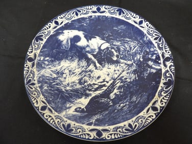 Delft blue ceramic charger plate with a hunting dog and pheasant scene signed