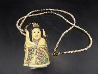 fine large Japanese figural pendant and long pearl necklace