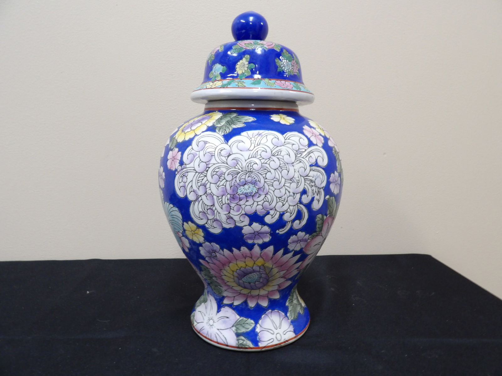 Chinese porcelain ginger jar with blue background floral pattern: 12.5 inches height.