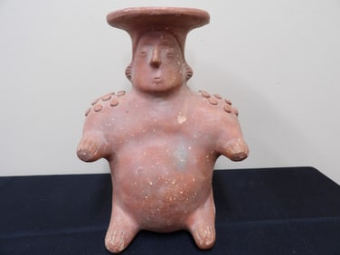 native American pottery seated male figural jug