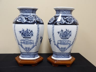 pair of Bombay Co. made in Chinese blue and white floral porcelain vases with wooden bases