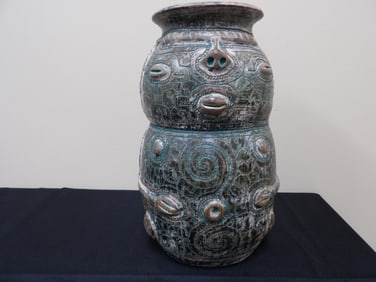 Brazilian glazed and incised pottery vase with face motif 12 inches height