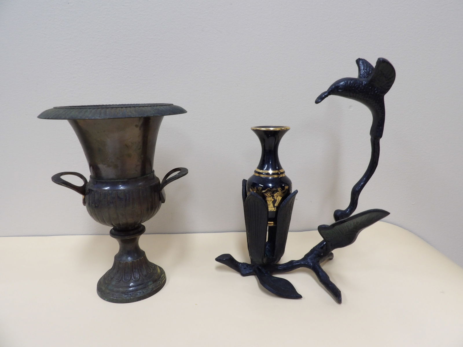 Lot of 3 bronze urn, bronze bird figurine and mini 24k gold gilt vase: Bronze urn is 7 inches height. Mini 3.7 inches height vase is marked made in Greece in 24k gold.